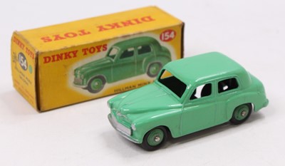 Lot 1283 - A Dinky Toys No. 154 Hillman Minx saloon,...