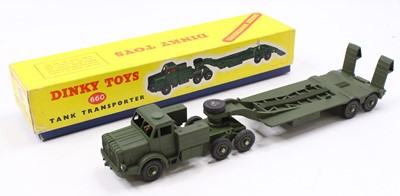 Lot 1438 - A Dinky Toys No. 660 military tank transporter...