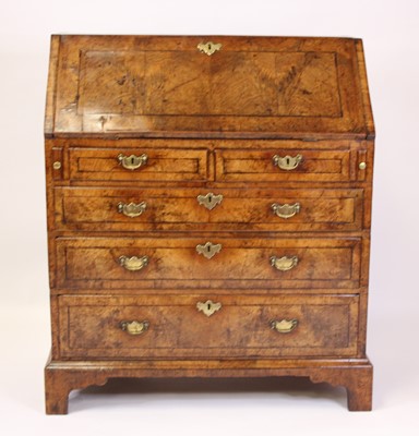 Lot 2504 - A George II walnut slopefront writing bureau...