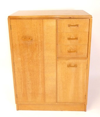 Lot 371 - Ernest Gomme for G-Plan - a 1960s blond oak...