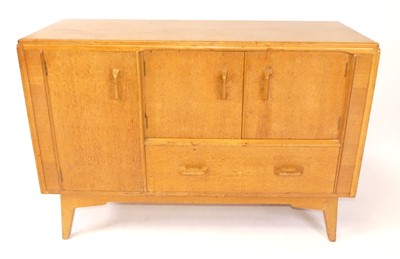 Lot 370 - Ernest Gomme for G-Plan - a 1960s blond oak...