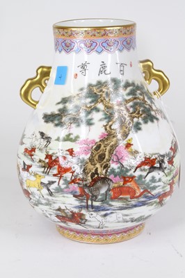 Lot 16 - A Chinese porcelain vase of Hu shape, enamel...
