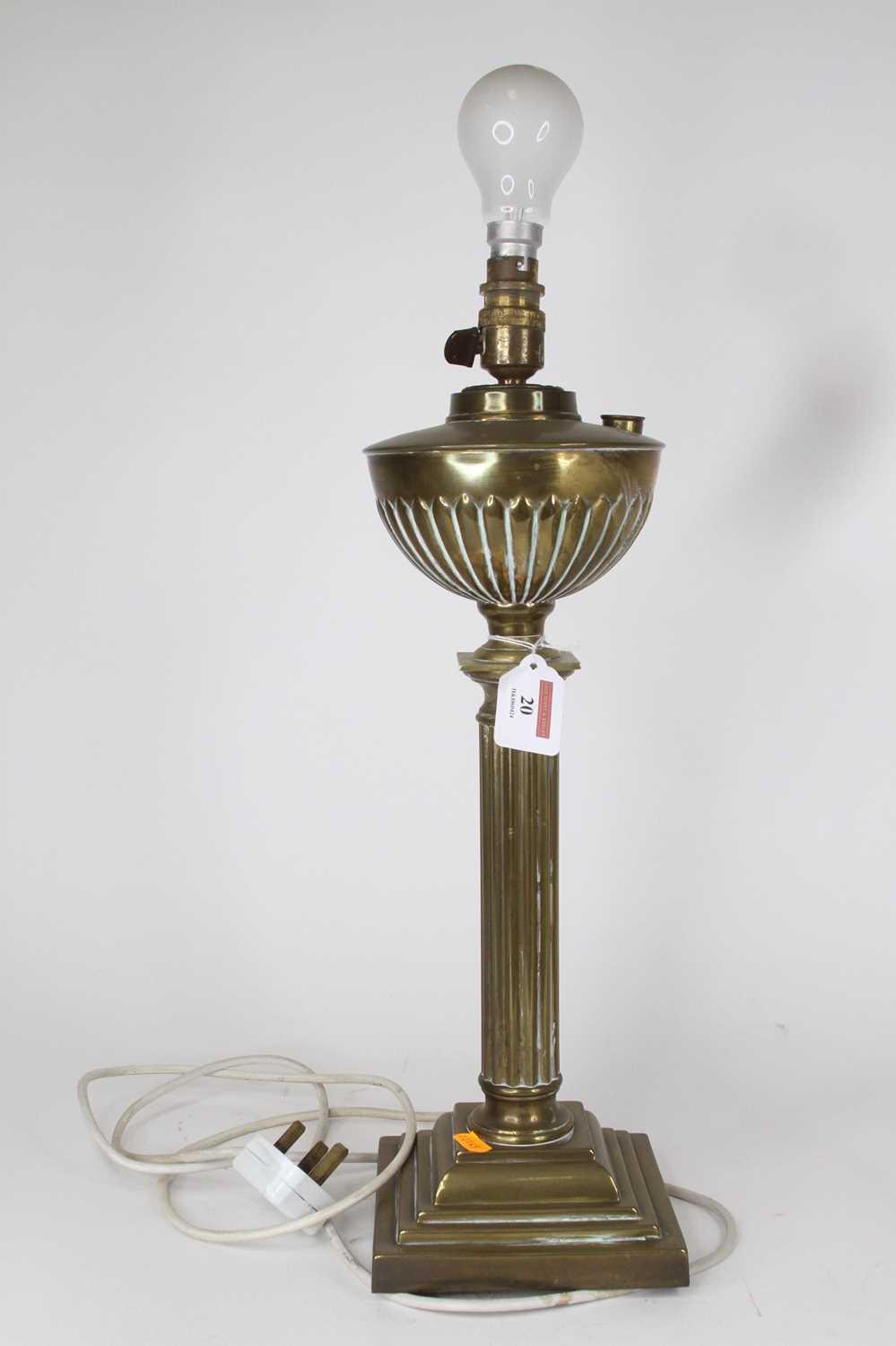Lot 20 - A late 19th century brass oil lamp, converted,...
