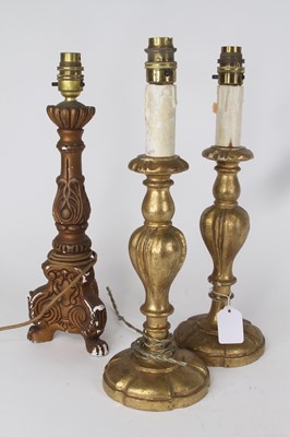 Lot 22 - A pair of giltwood table lamps in the 18th...