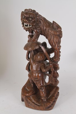 Lot 26 - A 20th century Chinese carved hardwood figure...