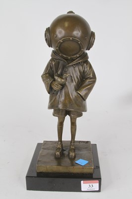 Lot 33 - A bronzed metal figure of a young girl wearing...