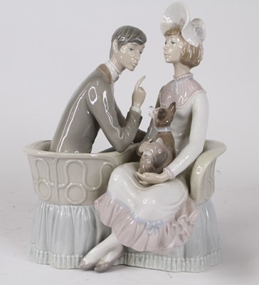 Lot 37 - A Lladro porcelain figure group of a couple...