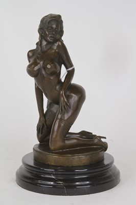 Lot 40 - A bronzed metal figure of a nude woman,...