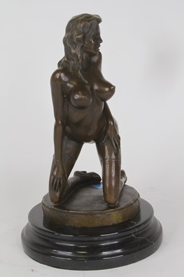 Lot 40 - A bronzed metal figure of a nude woman,...