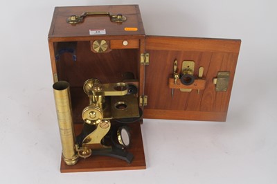 Lot 44 - A 19th century lacquered monocular microscope,...
