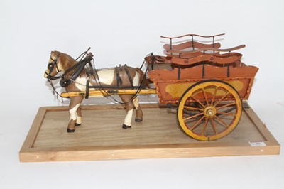 Lot 49 - A painted wooden model of a stagecoach with...