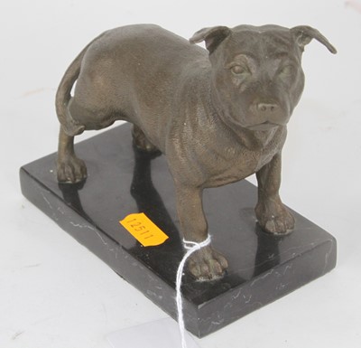Lot 51 - A bronzed metal model of a dog, shown standing...