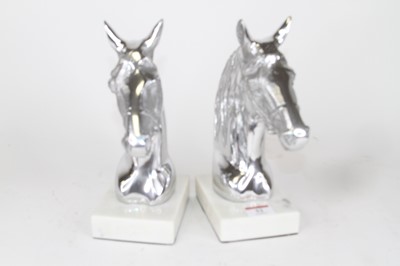 Lot 52 - A pair of polished metal horse head busts,...