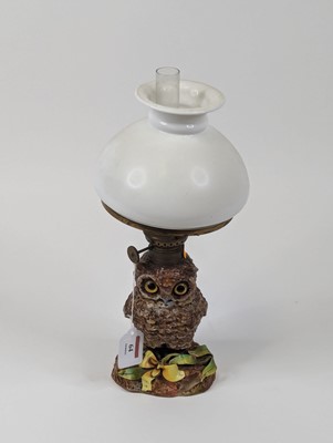 Lot 64 - A late 19th century novelty oil lamp, having...