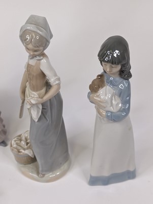 Lot 71 - A Lladro porcelain figure of a lady, shown...