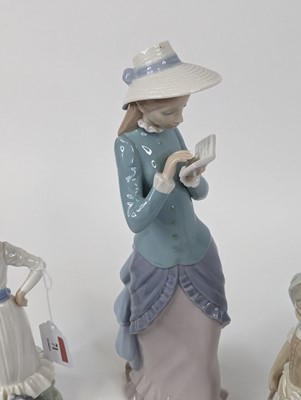 Lot 71 - A Lladro porcelain figure of a lady, shown...