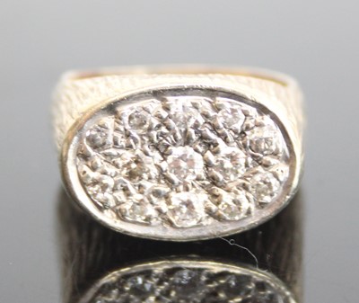 Lot 2570 - A yellow and white metal diamond oval signet...