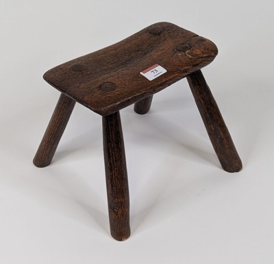 Lot 73 - A 19th century provincial elm milking stool, h....