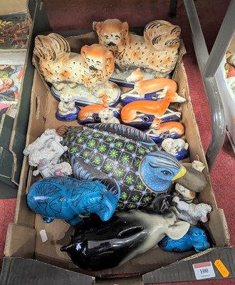Lot 100 - A collection of Staffordshire pottery figures,...