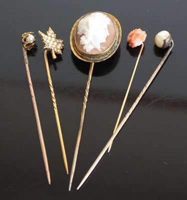 Lot 2583 - Five assorted yellow metal stick pins to...