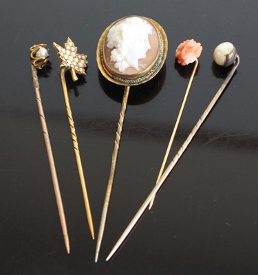 Lot 325 - Five assorted yellow metal stick pins to...