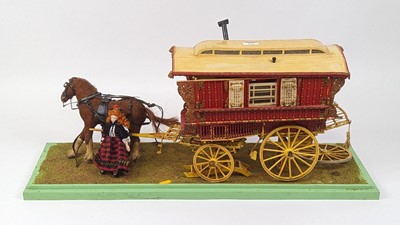 Lot 115 - A painted wooden model of a 'gypsy' caravan,...
