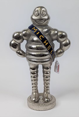 Lot 117 - A polished metal figure of the Michelin Man, h....