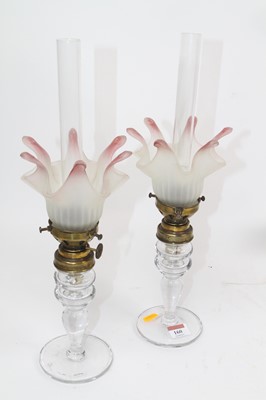 Lot 160 - A pair of 20th century oil lamps, each having...