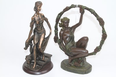 Lot 162 - A bronzed resin figure of a nude woman beneath...