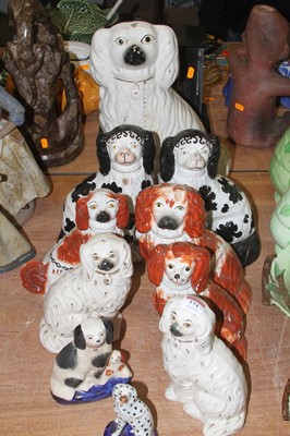 Lot 171 - A collection of Staffordshire pottery spaniels,...