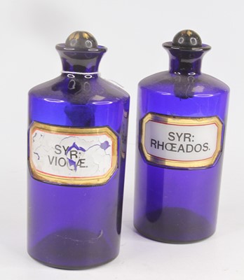 Lot 235 - Two 19th century blue glass apothecary bottles,...