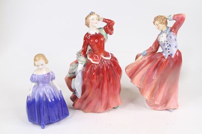 Lot 240 - A collection of three Royal Doulton figures,...