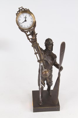 Lot 254 - A figural Aviator bronzed mystery clock, h.38cm