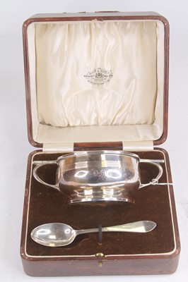 Lot 297 - A George V silver twin handled porringer,...