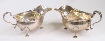 Lot 301 - A pair of George V silver helmet shaped...