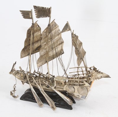 Lot 310 - An Eastern white metal model of a junk,...