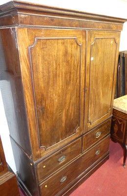 Lot 1154 - A 19th century mahogany linen press, with twin...