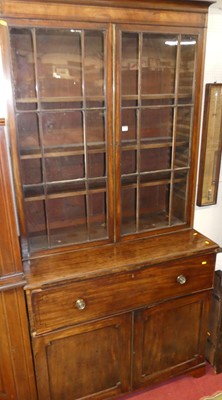 Lot 1162 - An early 19th century mahogany secretaire...