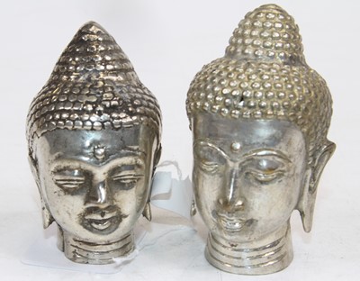 Lot 505 - Two white metal Buddha heads, largest h.8cm