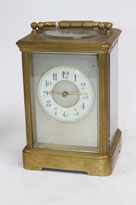 Lot 507 - A brass carriage clock, the enamelled chapter...