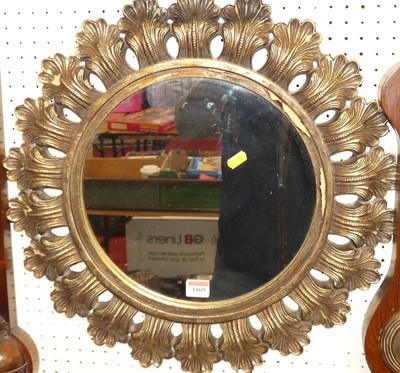 Lot 1169 - A contemporary circular wall mirror, with...