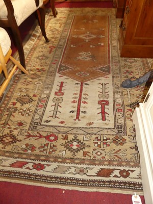 Lot 1182 - A Turkish woollen Bodrum cream ground rug, 236...