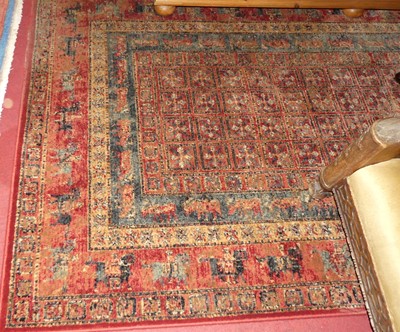 Lot 1183 - A machine woven Persian style red ground...