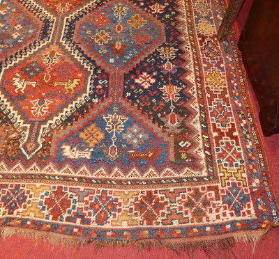 Lot 1184 - A Persian woollen red and blue ground Heriz...