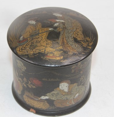 Lot 518 - A Japanese black lacquered and gilt decorated...