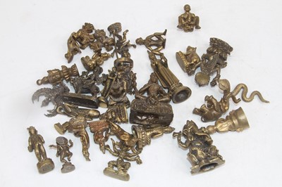 Lot 524 - A collection of Eastern miniature brass...