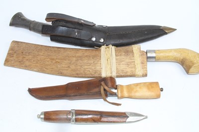 Lot 558 - A kukri knife; together with three further knives