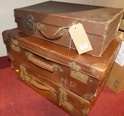 Lot 1093 - Three various vintage faux leather suitcases,...