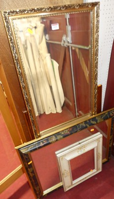 Lot 1111 - A gilt framed and bevelled rectangular wall...