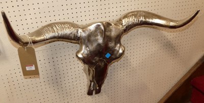 Lot 1151 - A pair of contemporary polished metal buffalo...